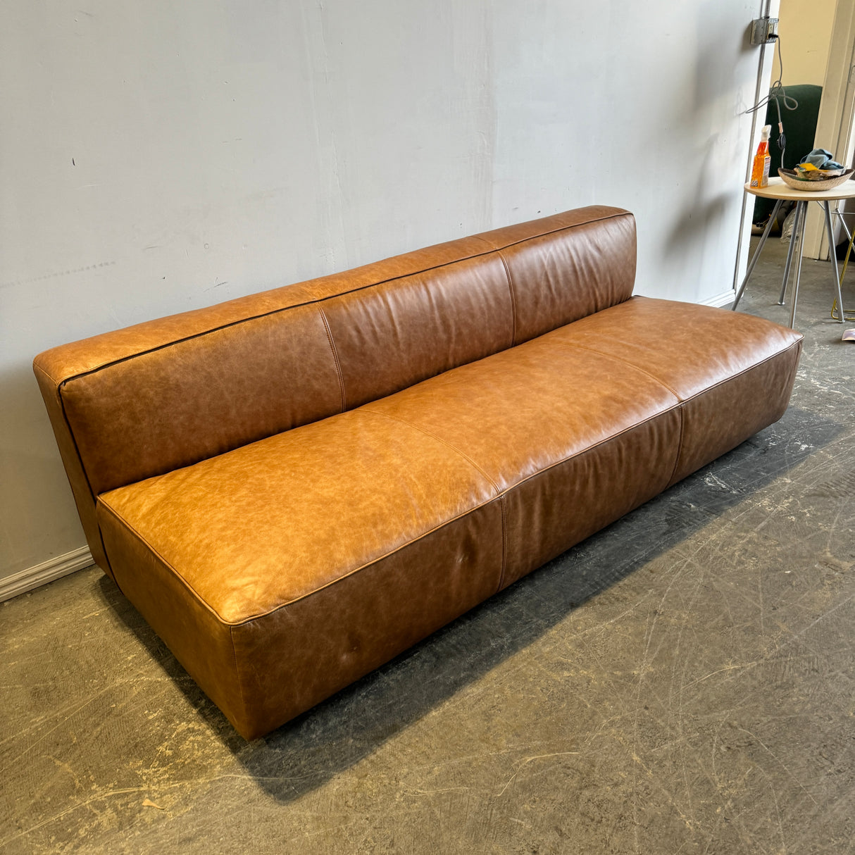 CB2 Lenyx Saddle Leather Armless Sofa